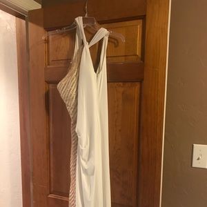 Long white with gold side accents evening gown.